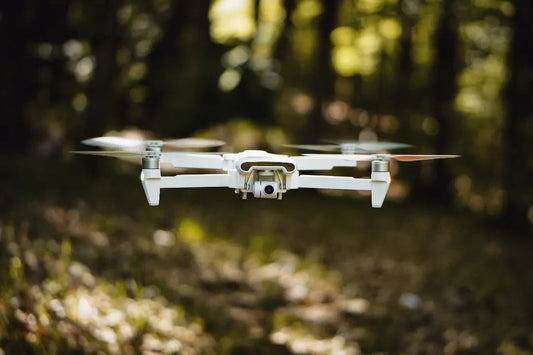 Wave lapping at rocks---by FIMI X8SE 2022